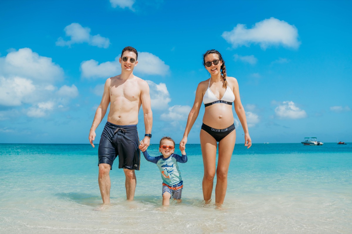 Family walking in the shallows, Aruba
