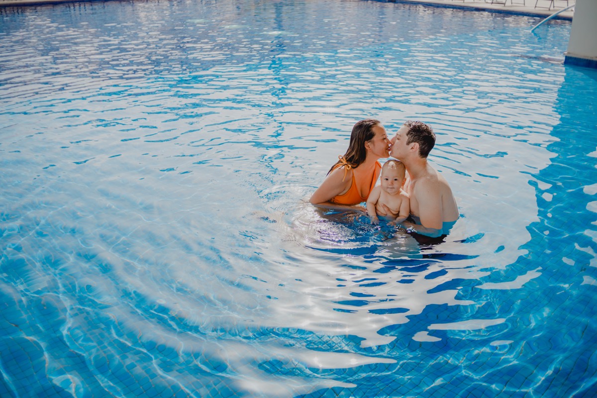 Parents in the resort pool, Cancún