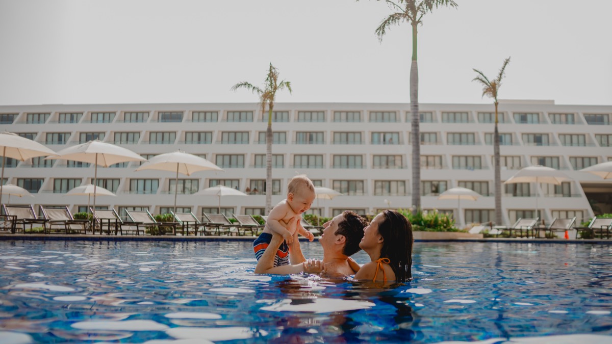 Mother and baby in the resort pool, Cancún