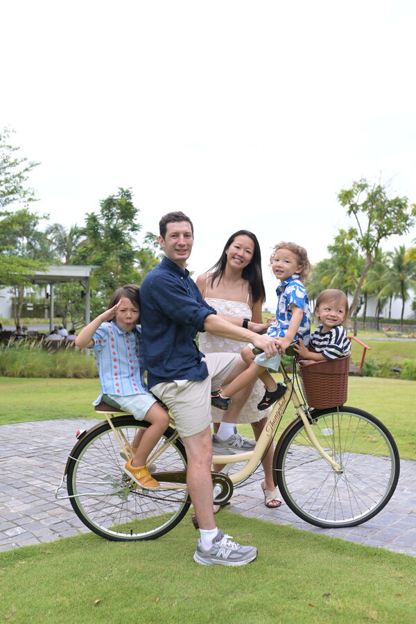 Dad and kids on a resort bike, Da Nang